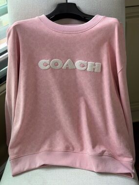 Signature pink COACH sweatshirt.  Brand new, never worn. Lovely!